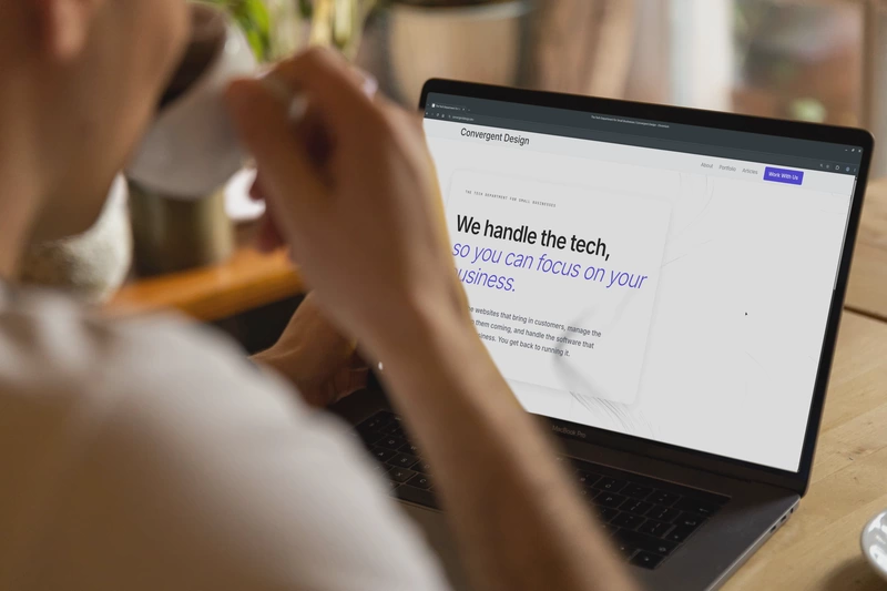 a man drinking coffee while looking at a well-built website